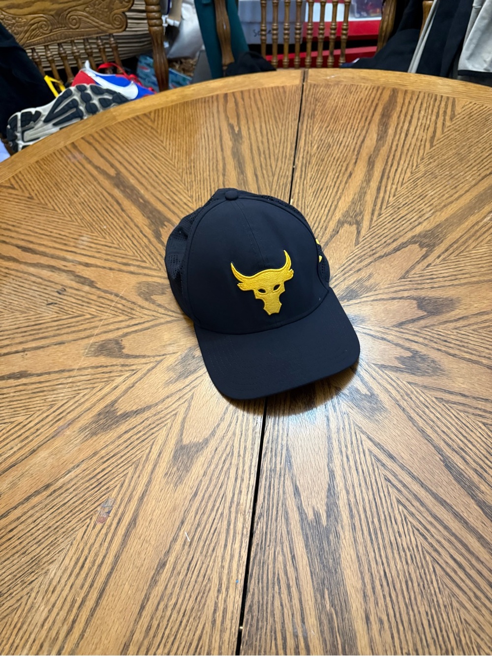 Under Armour Project Rock Black Trucker Hat with Yellow Bull Emblem